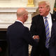 Trump shaking hands with Bezos at a White House event in 2017.